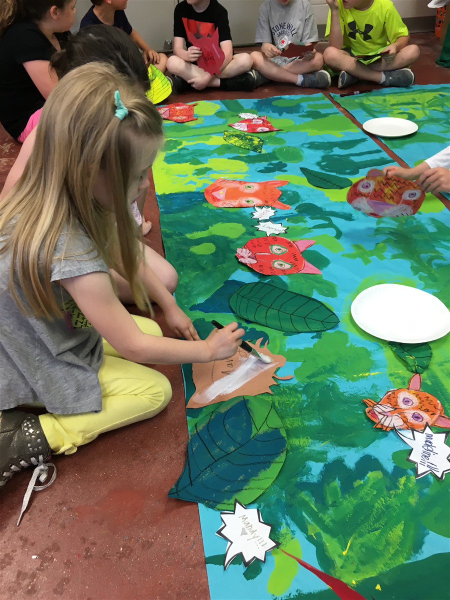 1st Grade working hard on their Henri Rousseau inspired mural!